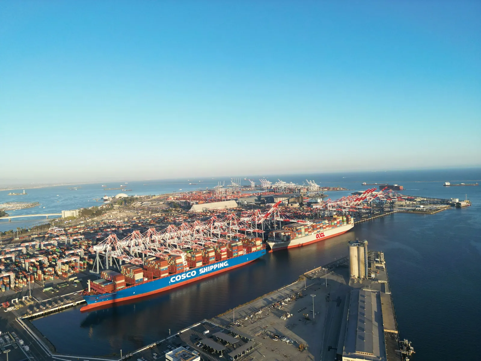 A container vessel alongside cranes at the Port of Long Beach