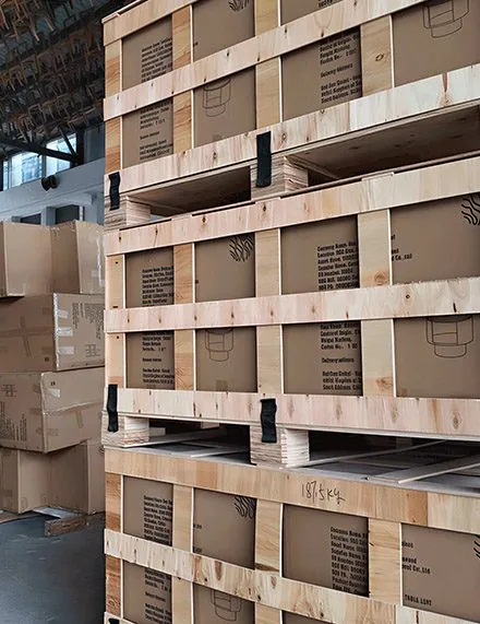 Cartons protected by timber frames and secured with straps