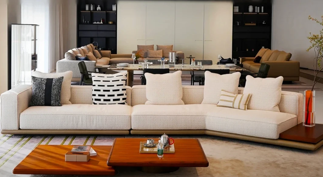Sofa, timber coffee tables and a stone dining table in a Foshan furniture showroom