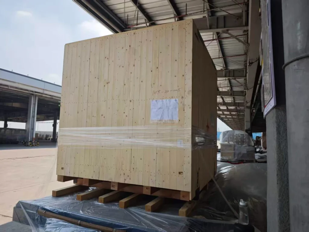 Wooden crates and bracing protecting cargo during a handling stage.