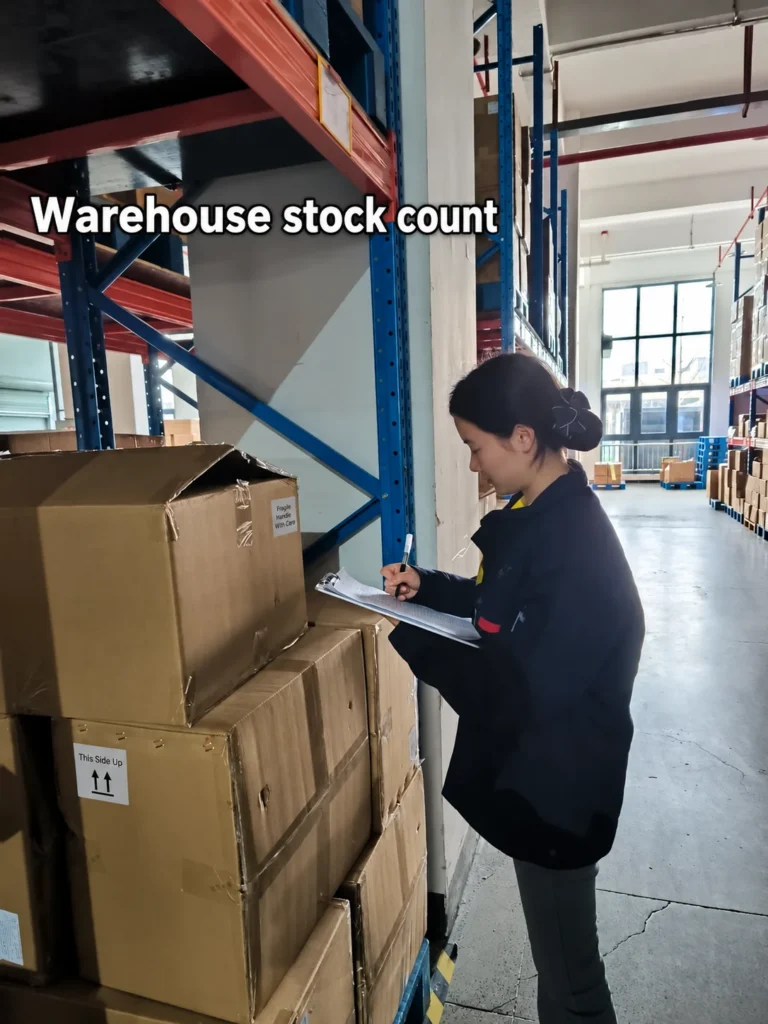 A worker recording a warehouse stock count on a clipboard.