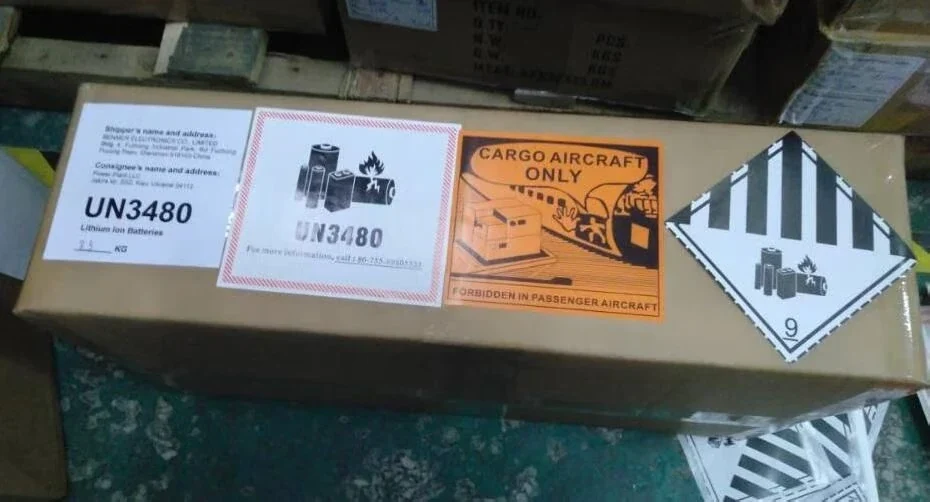 An example of battery shipping marks and a Cargo Aircraft Only label in a source photograph.
